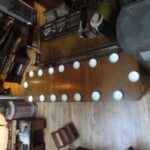 Antique English oak concertina dining table, extendable with double moulding edges 1