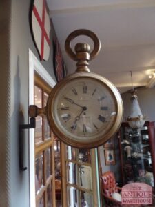 antique watchmaker sign clock