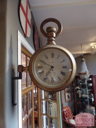 antique watchmaker sign clock